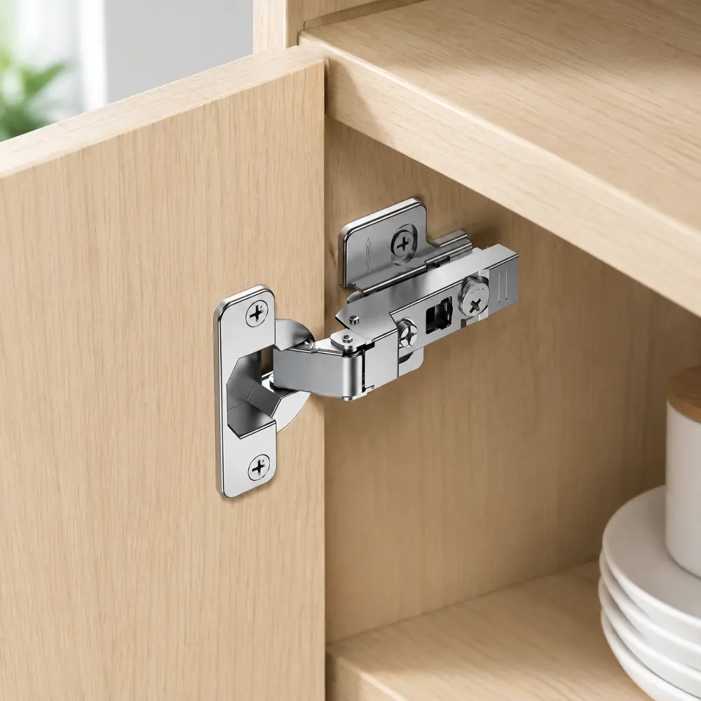 Detailed view of the hinge arm adjustment mechanism, showing the internal springs and the nickel-plated surface texture.